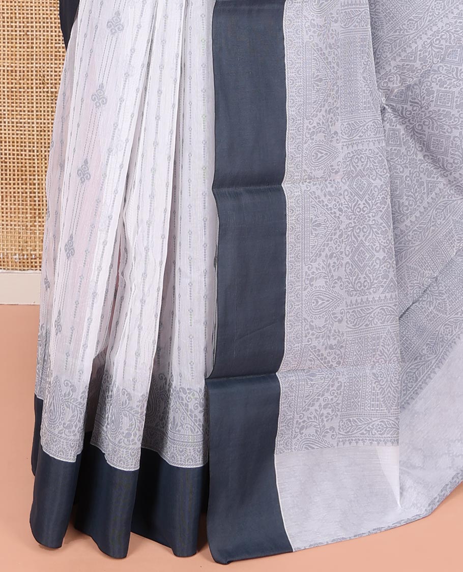 Grey Semi-Silk Cotton Saree, Sparsely Woven with Buttas and Geometric Designs All Over Its Body, Complemented by Contrast Border, Sparsely Woven Pallu of Geometric Designs, and Paired with a Matching Blouse