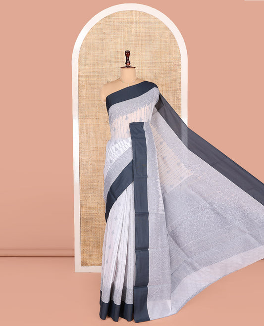 Grey Semi-Silk Cotton Saree, Sparsely Woven with Buttas and Geometric Designs All Over Its Body, Complemented by Contrast Border, Sparsely Woven Pallu of Geometric Designs, and Paired with a Matching Blouse
