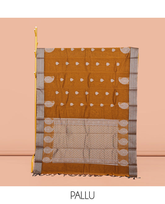 Mustard Semi-Silk Cotton Saree, Delicately Designed with Buttas All Over Its Body, Traditional Design Border of Paisleys, Geometric-Patterned Pallu, and Paired with a Matching Blouse