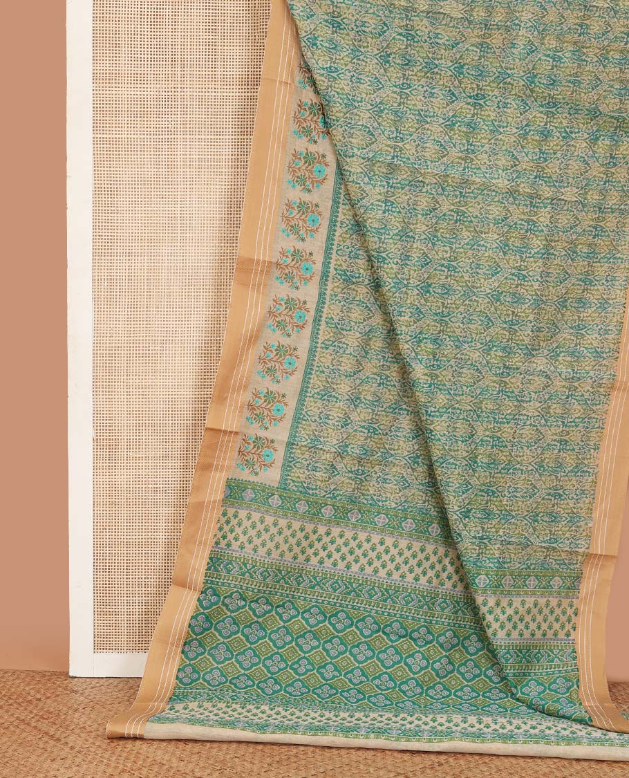 Blue ogee printed chanderi cotton saree, contrast traditional motifs with floral thread embroidery, and printed pallu