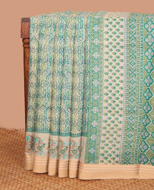 Blue ogee printed chanderi cotton saree, contrast traditional motifs with floral thread embroidery, and printed pallu