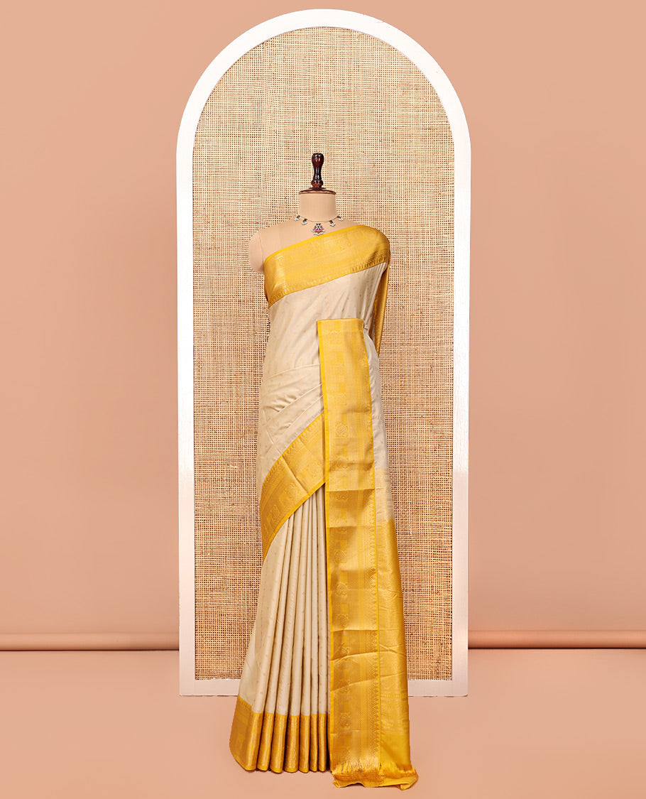 Biscuit-Yellow Budget Silk Saree, Subtly Sparkled with Zari Buttas, a Contrast Traditional Zari Border, Grand Pallu, and a Contrast Blouse