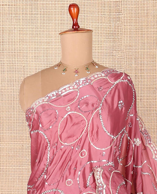 Pink embroidered designer saree features circular-shaped motifs woven in stones & sequins, scallop embroidered border