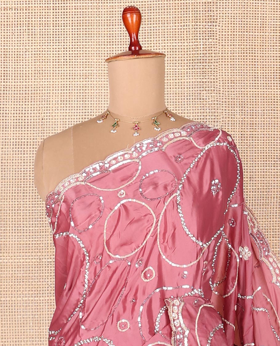 Pink embroidered designer saree features circular-shaped motifs woven in stones & sequins, scallop embroidered border