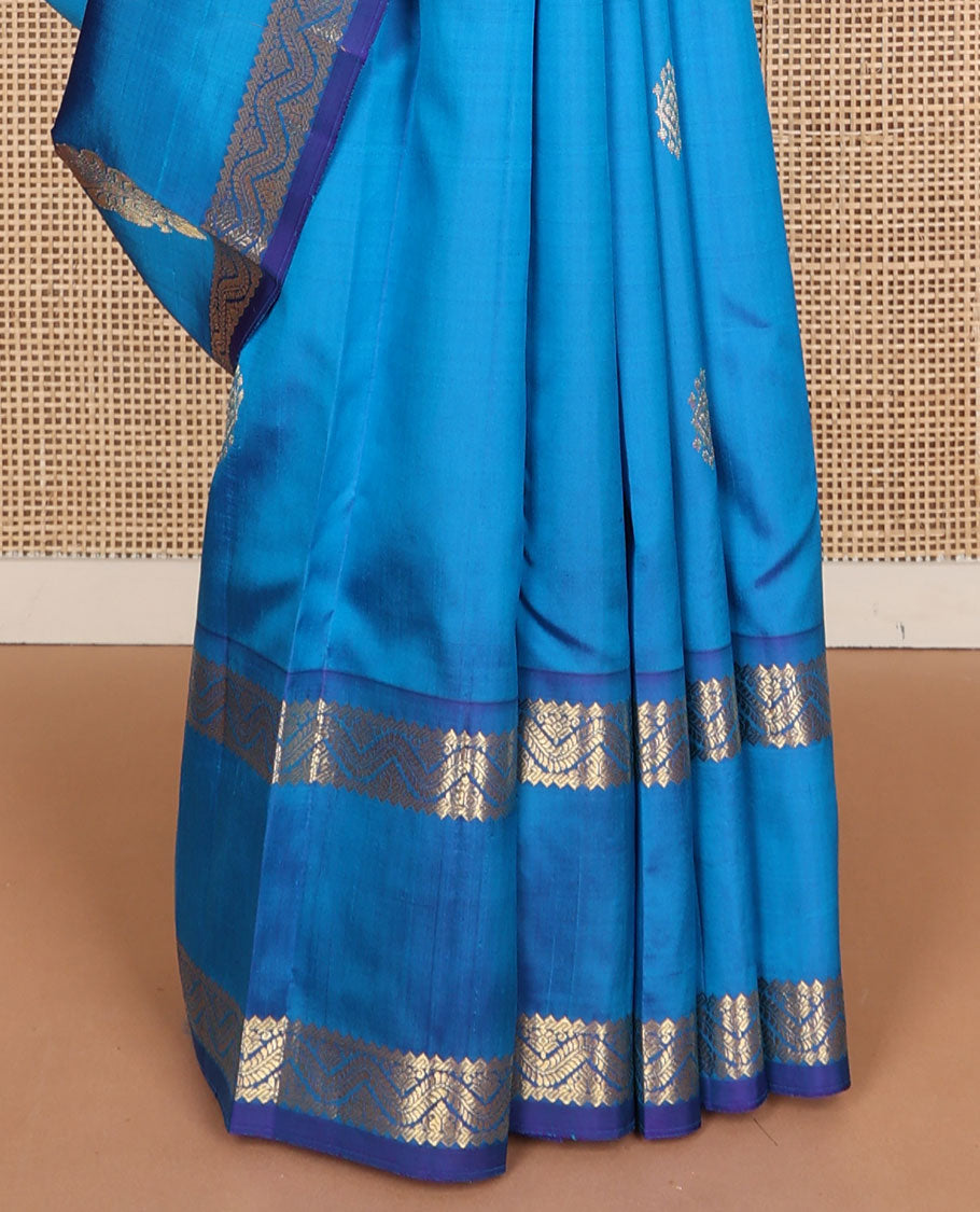 Blue zari buttas Kanchipuram silk saree, one-sided zari border of rekku, banaras, and neli designs, and floral design pallu