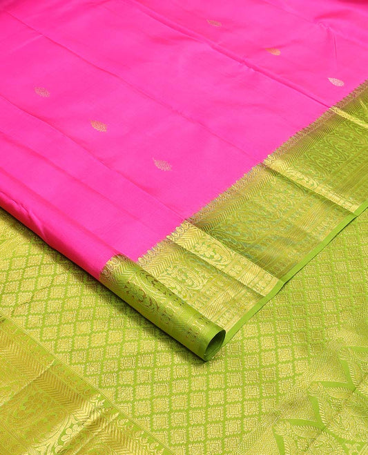 Pink zari buttas Kanchipuram silk saree, contrast zari border of vanki, kodi visiry, and poun designs, and contrast pallu of jaal design