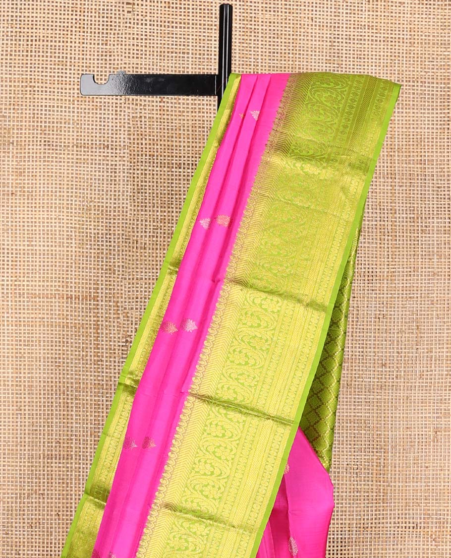 Pink zari buttas Kanchipuram silk saree, contrast zari border of vanki, kodi visiry, and poun designs, and contrast pallu of jaal design