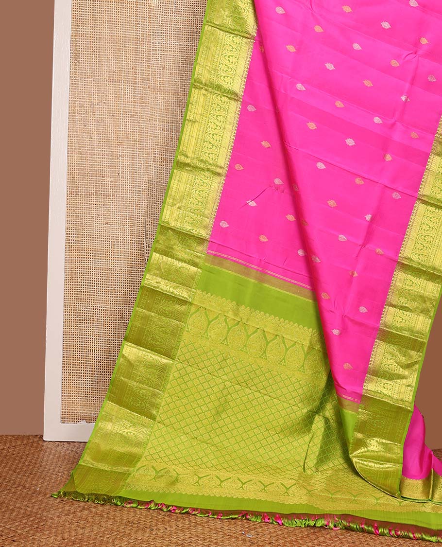 Pink zari buttas Kanchipuram silk saree, contrast zari border of vanki, kodi visiry, and poun designs, and contrast pallu of jaal design