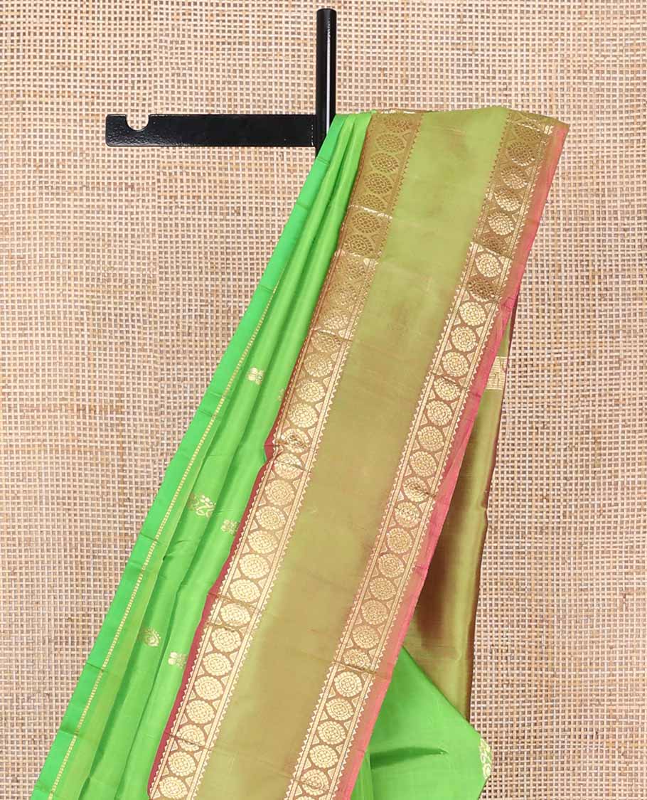 Green buttas kancheepuram silk saree with contrast rettai pettu border of rekku, banaras, poo chakram design & zari design pallu