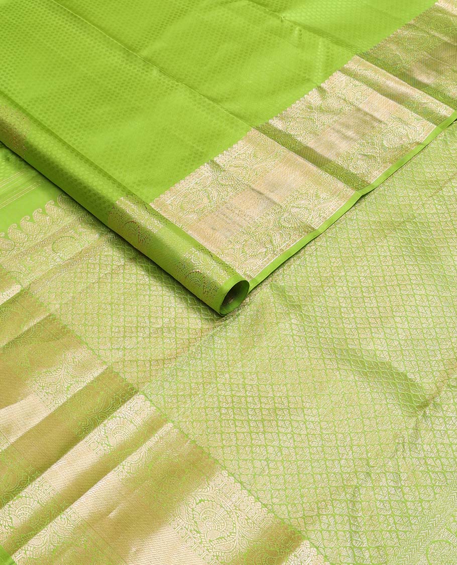Green floral design silk saree with self border of thilakam mokku, paun, kodi visiry, banaras design & zari design pallu