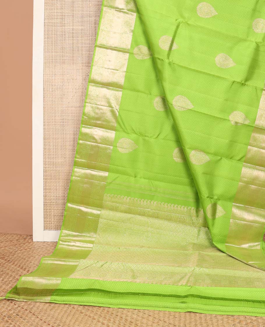 Green floral design silk saree with self border of thilakam mokku, paun, kodi visiry, banaras design & zari design pallu
