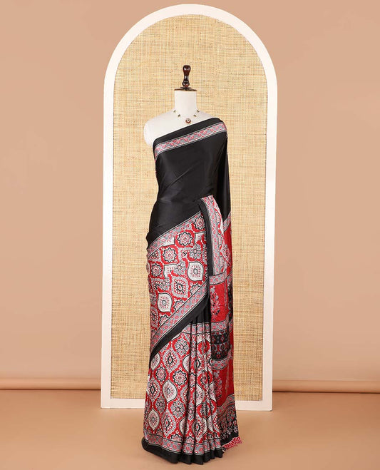 Black half-&-half style modal satin saree features floral & geometric design Ajrakh printed contrast border & pallu