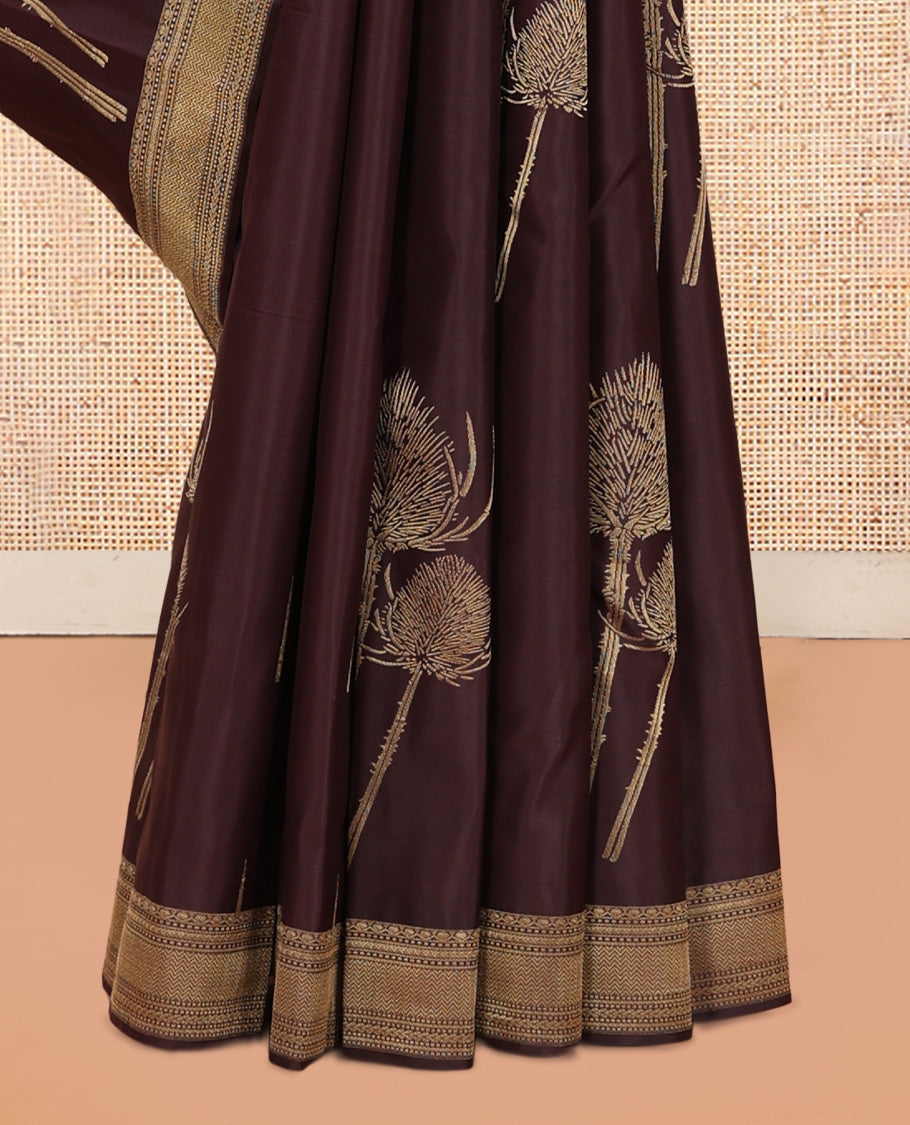 Coffee Brown Vasundhara Silk Saree Decked Up with Thazampoo Rekku Buttas and Vel Buttas, Highlighted with a Zari Border of Manga, Muthu, Kathir, Neli, and Vanki Designs, Subtly Sparkled Pallu of Jaal Design, and Paired with a Matching Blouse