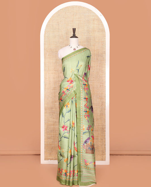 Green Printed Silk Saree Enthralled with Multi-Colored Hand Brush Painting-Style Floral and Bird Print, Complemented by a Contrast Border, Colorful Floral and Bird-Print Pallu, and a Matching Blouse of Bud Motifs Print