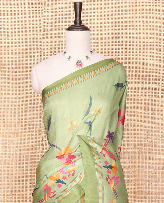 Green Printed Silk Saree Enthralled with Multi-Colored Hand Brush Painting-Style Floral and Bird Print, Complemented by a Contrast Border, Colorful Floral and Bird-Print Pallu, and a Matching Blouse of Bud Motifs Print