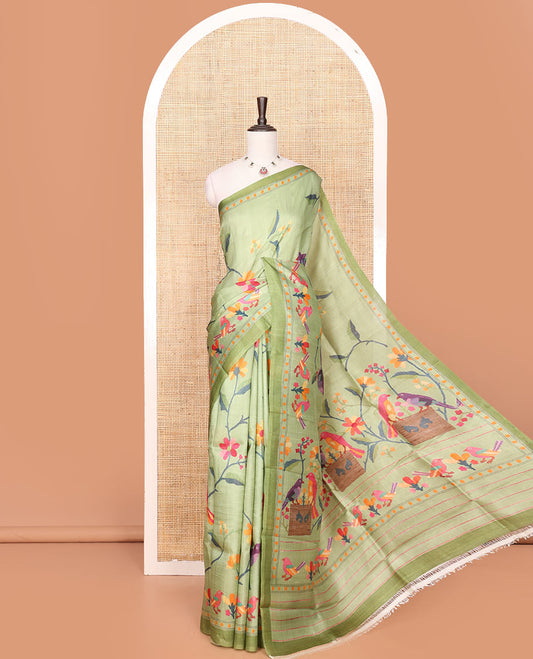 Green Printed Silk Saree Enthralled with Multi-Colored Hand Brush Painting-Style Floral and Bird Print, Complemented by a Contrast Border, Colorful Floral and Bird-Print Pallu, and a Matching Blouse of Bud Motifs Print