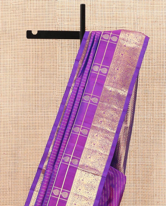 Violet Venkatagiri Silk Saree, Enthralled with Zari Stripes, Zari Buttas, and Zari Stripes All Over Its Body, Highlighted by a Traditional Zari Border of Peacock Designs, Pallu Steeped with Paisley and Triangle Designs, and Paired with a Matching Blouse