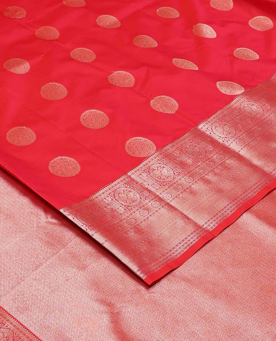 Red chakram zari buttas Vasundhara silk mix saree, zari border of rekku, cross kamalam, round mayil, chakram and then kuli kann and vanki design pallu