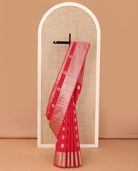 Red chakram zari buttas Vasundhara silk mix saree, zari border of rekku, cross kamalam, round mayil, chakram and then kuli kann and vanki design pallu