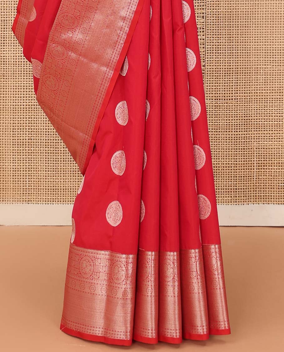 Red chakram zari buttas Vasundhara silk mix saree, zari border of rekku, cross kamalam, round mayil, chakram and then kuli kann and vanki design pallu