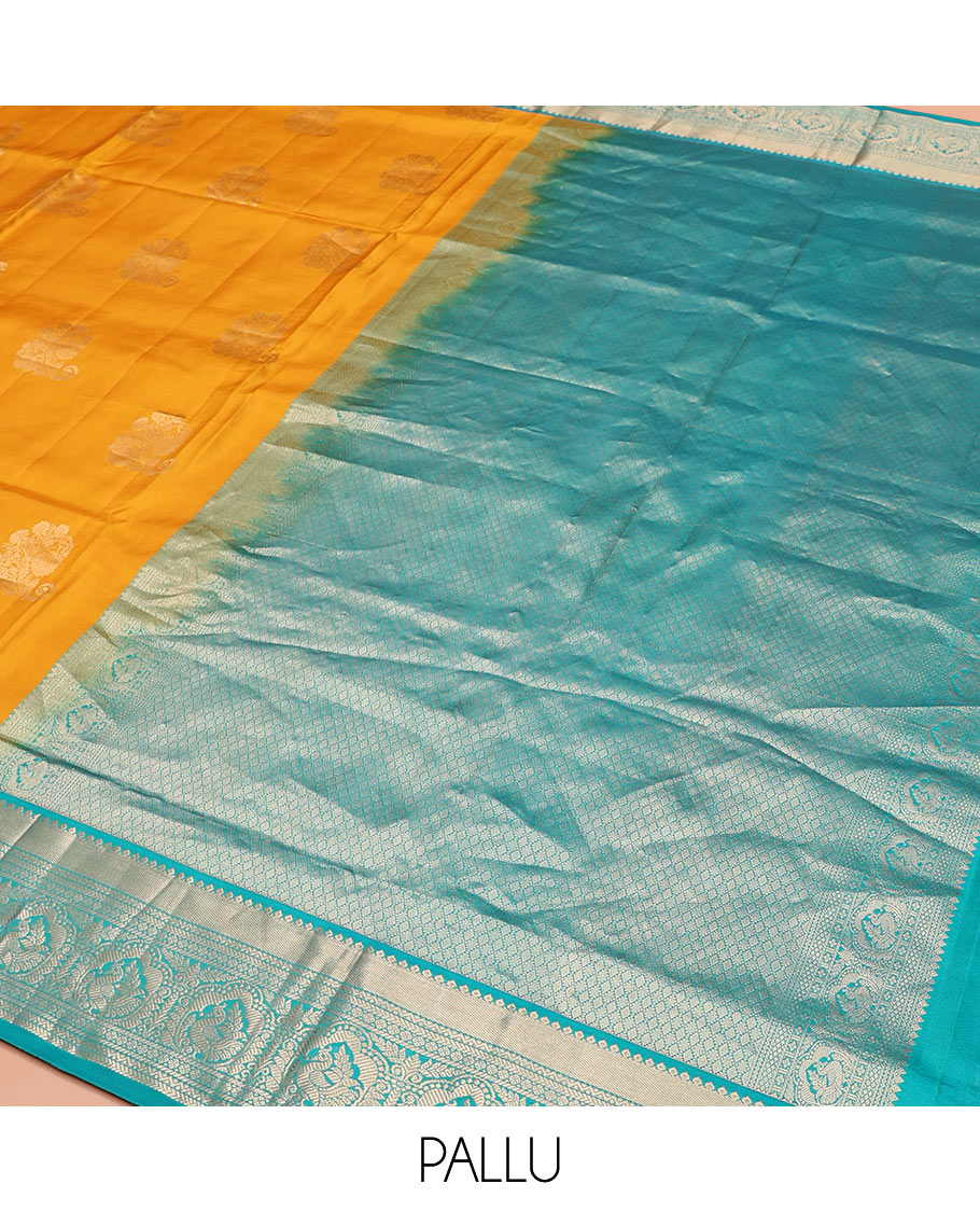 Yellow Vasundhara Silk Saree Ornamented with Zari Buttas All Over Its Body, Complemented by a Contrast Border of Neli, Kathir, Rudraksham, and Mayil Designs, Pallu Featuring Jaal Designs, and Paired with a Contrast Blouse