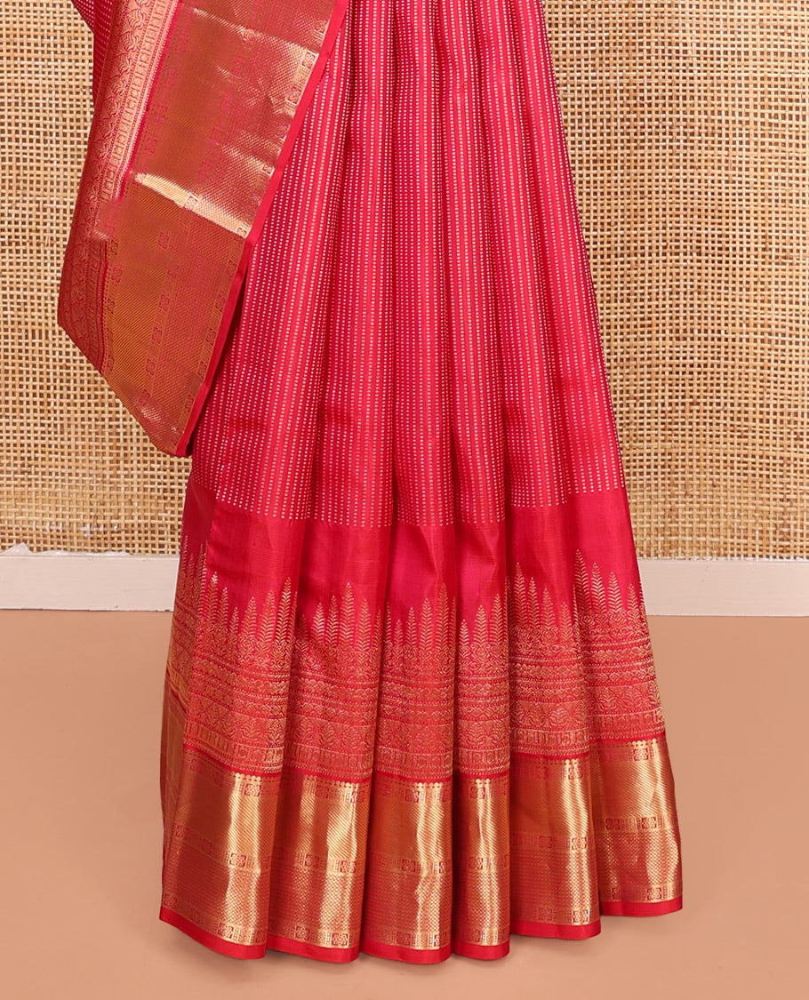 Red Vasundhara Silk Saree, Gleamed Up with Zari Muthu Stripes on Its Body, Highlighted by Zari Border of Traditional Designs, Geometric-Patterned Pallu, and Paired with a Matching Blouse