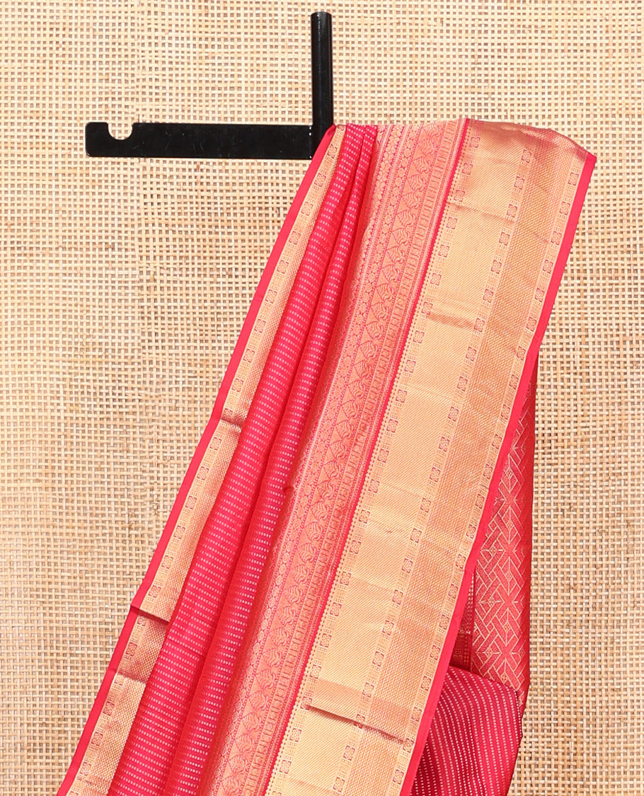 Red Vasundhara Silk Saree, Gleamed Up with Zari Muthu Stripes on Its Body, Highlighted by Zari Border of Traditional Designs, Geometric-Patterned Pallu, and Paired with a Matching Blouse
