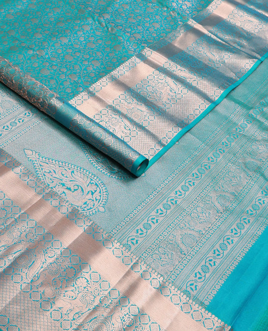 Blue jacquard wedding silksaree,zari border of thilakam mokku,laddu kamalam,singam,mayil chakram & jaal design & intricate pallu