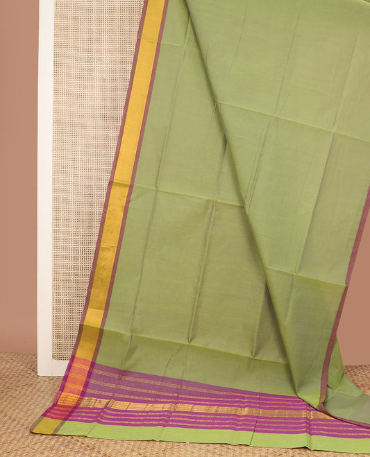 Parrot green plain Venkatagiri cotton saree, contrast plain border, and zari striped pallu