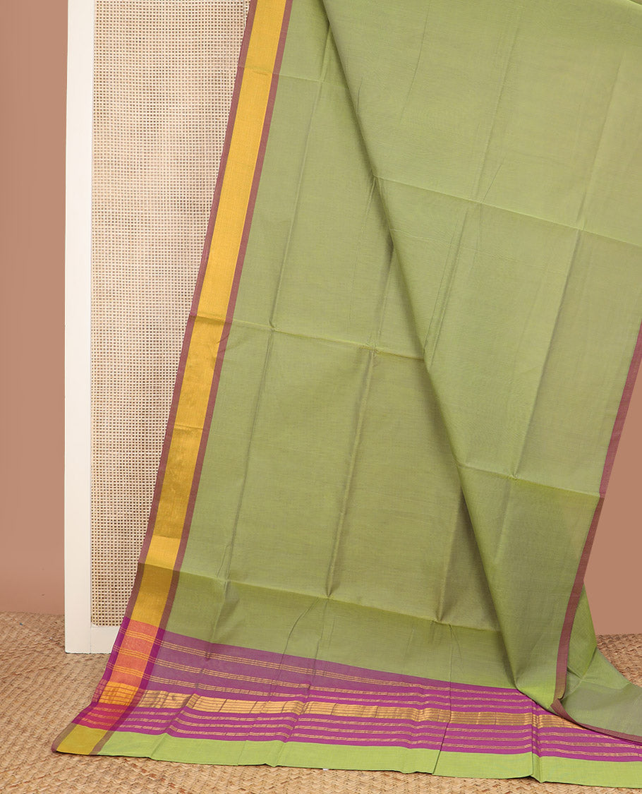 Parrot green plain Venkatagiri cotton saree, contrast plain border, and zari striped pallu