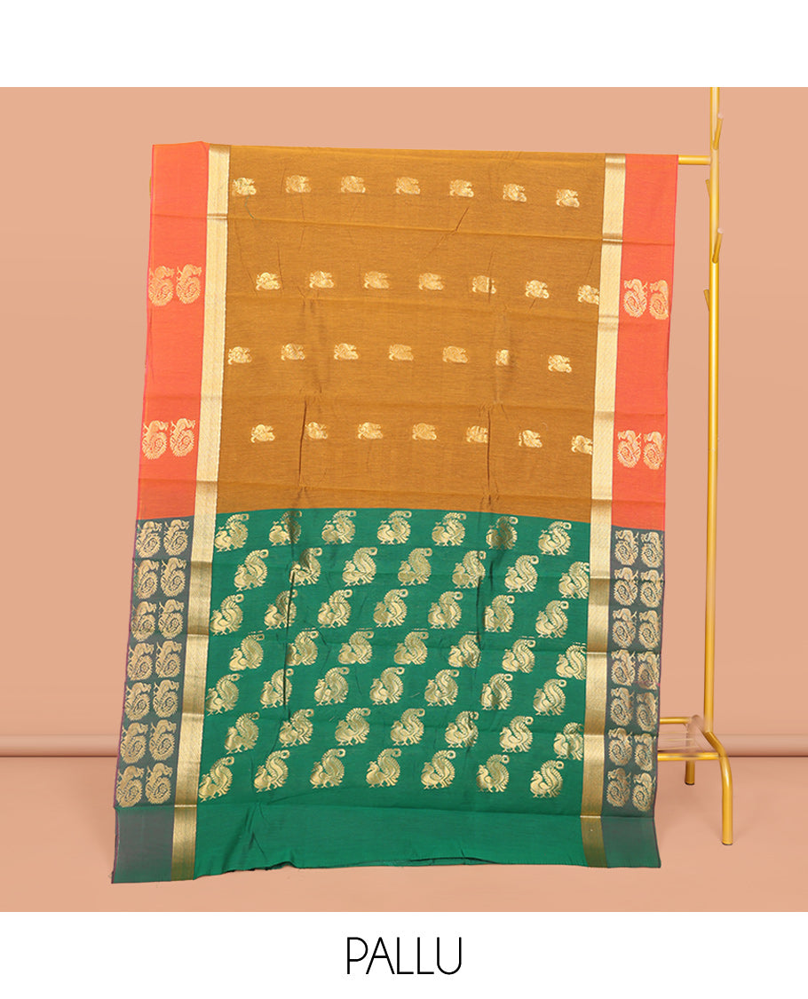 Mustard Semi-Silk Cotton Saree, Ornamented with Peacock Buttas All Over Its Body, Complemented by a Contrast Border of Peacock Designs, Pallu Steeped with Peacock Designs, and Paired with a Contrast Blouse