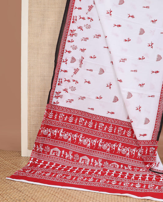 White warli village-theme printed mul mul cotton saree, contrast warli printed red border & pallu of warli motifs print