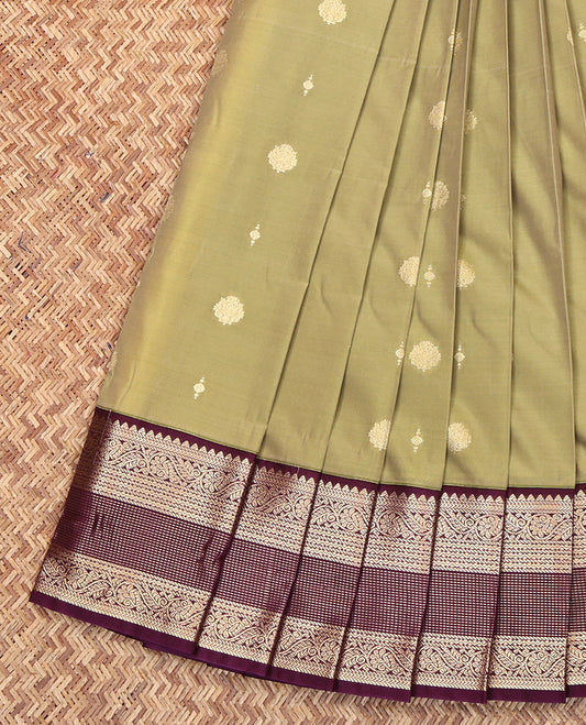 Green Budget Silk Saree, Adorned with Zari Buttas All Over Its Body, Complemented by Contrast Border of Traditional Zari Designs, Gleaming Zari Design Pallu, and Paired with a Contrast Blouse