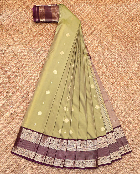 Green Budget Silk Saree, Adorned with Zari Buttas All Over Its Body, Complemented by Contrast Border of Traditional Zari Designs, Gleaming Zari Design Pallu, and Paired with a Contrast Blouse