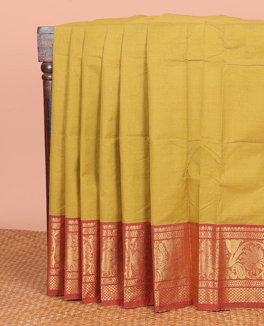 Mustard Plain Chettinad Cotton Saree, Complemented by a Contrast Traditional Zari Border of Peacock Designs, a Pallu of Zari Stripes, and Paired with a Matching Blouse