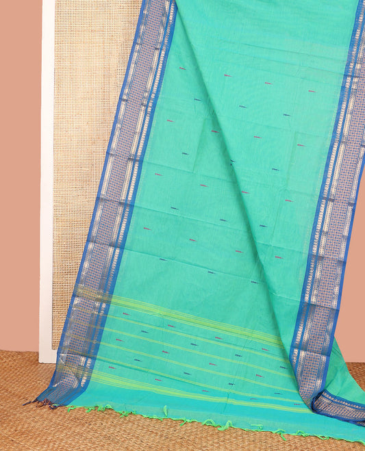 Turquoise Chettinad Cotton Saree Subtly Woven with Thread Buttas on Its Body, Complemented by a Contrast Traditional Design Woven Zari Border, Subtly Striped Pallu, and Paired with a Matching Blouse