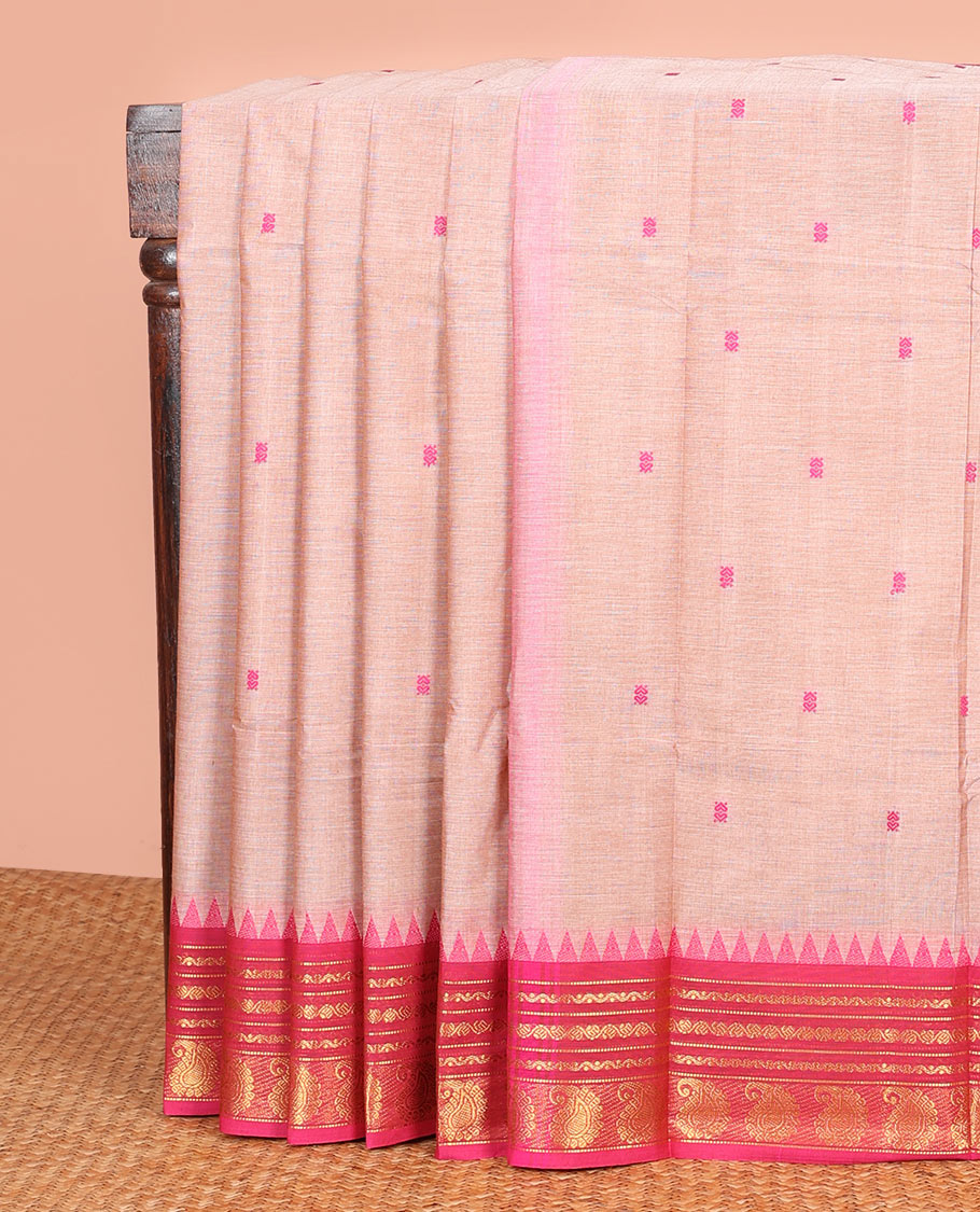 Pale Pink Color Chettinad Cotton Saree Subtly Woven with Thread Buttas on Its Body, Complemented by a Contrast Temple Traditional Border of Paisleys, Subtly Striped Pallu, and Paired with a Matching Blouse