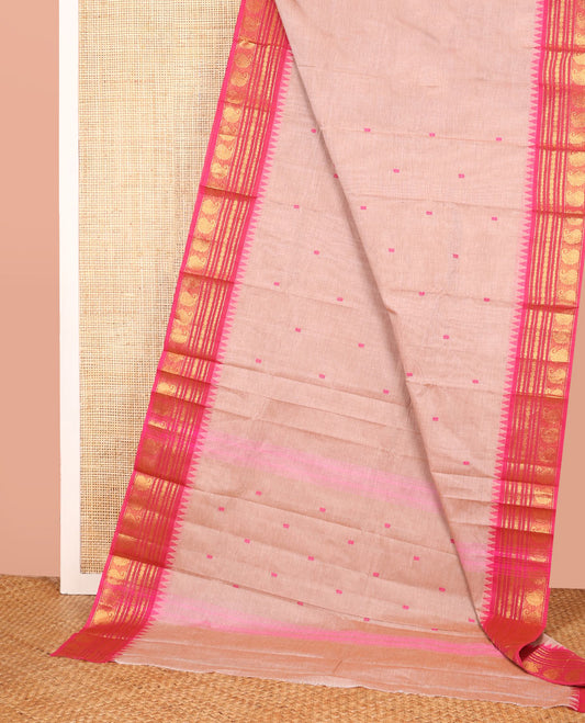 Pale Pink Color Chettinad Cotton Saree Subtly Woven with Thread Buttas on Its Body, Complemented by a Contrast Temple Traditional Border of Paisleys, Subtly Striped Pallu, and Paired with a Matching Blouse