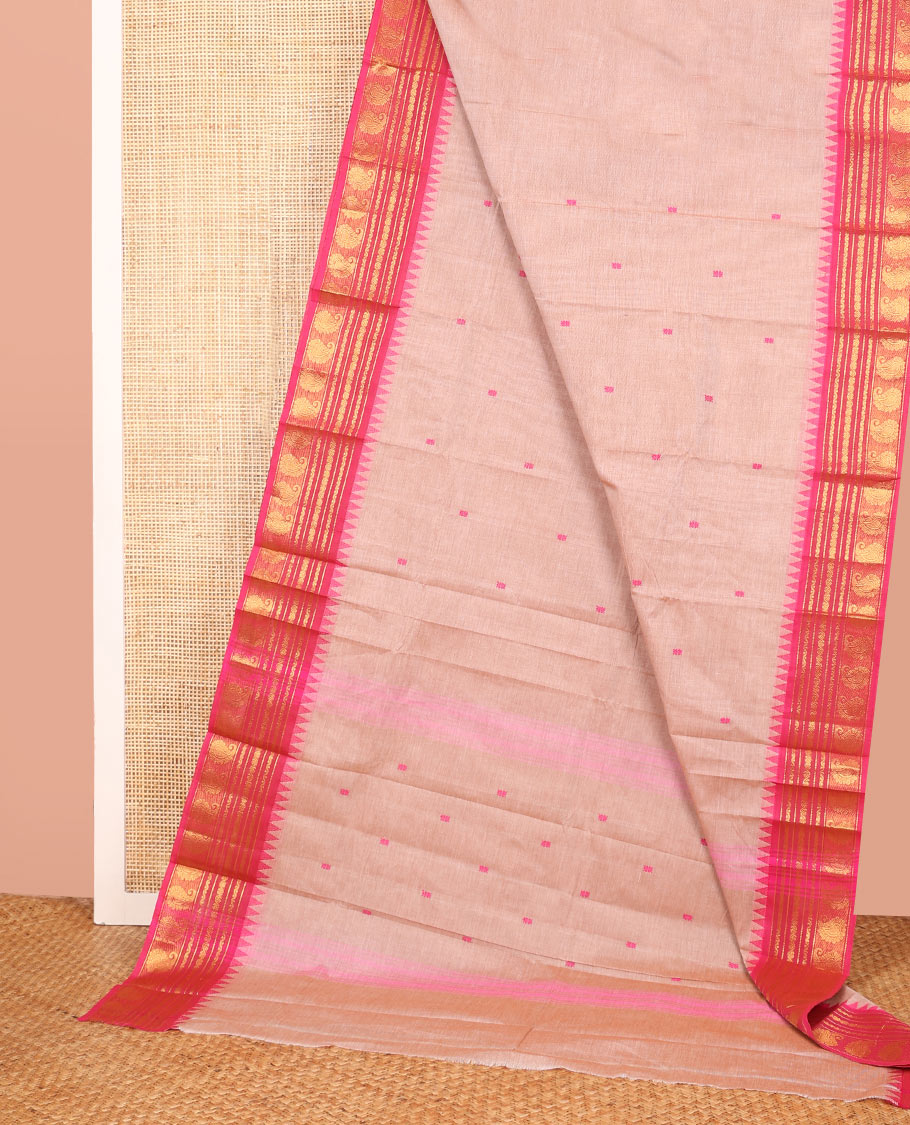 Pale Pink Color Chettinad Cotton Saree Subtly Woven with Thread Buttas on Its Body, Complemented by a Contrast Temple Traditional Border of Paisleys, Subtly Striped Pallu, and Paired with a Matching Blouse