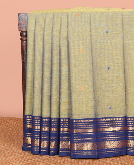 Green Chettinad Cotton Saree Prettified with Thread Buttas All Over Its Body, Complemented by Contrast Ganga-Jamuna Border of Traditional Zari Designs, Pallu of Subtle Stripes and Buttas, and Paired with a Matching Blouse