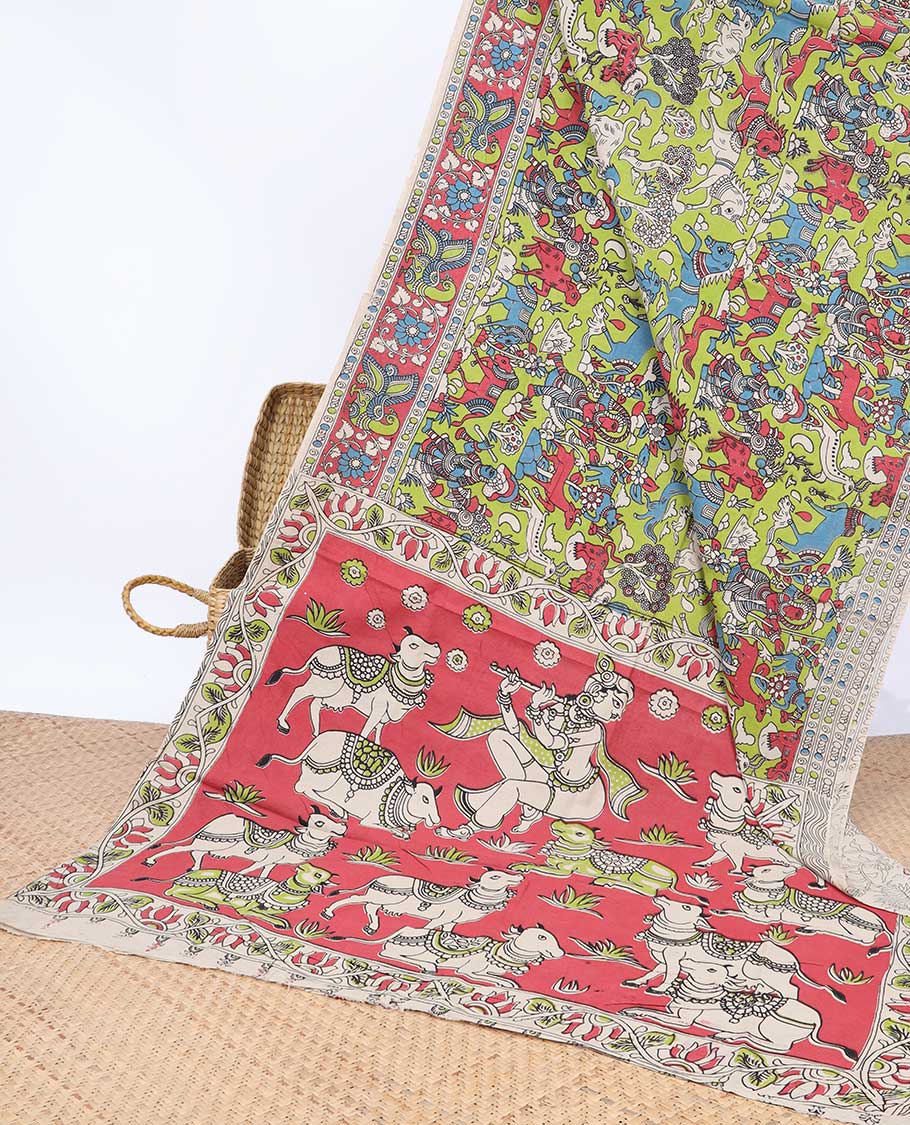 Green village-theme machine-printed kalamkari cotton saree, contrast border & pallu of Pichwai cows & God Krishna