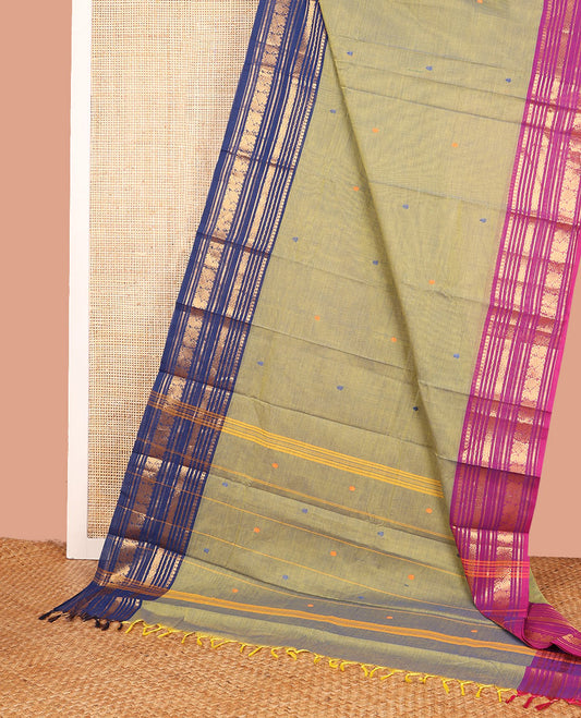 Green Chettinad Cotton Saree Prettified with Thread Buttas All Over Its Body, Complemented by Contrast Ganga-Jamuna Border of Traditional Zari Designs, Pallu of Subtle Stripes and Buttas, and Paired with a Matching Blouse