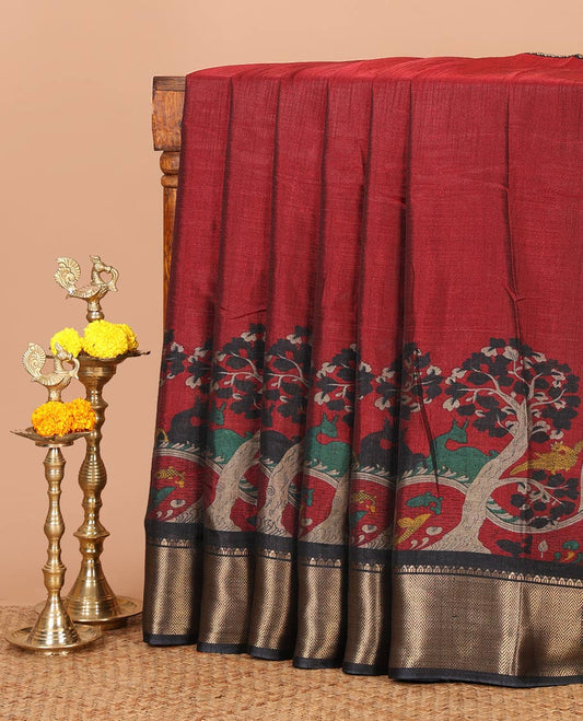Red skirt-style kalamkari printed dola silksaree, contrast copper zari border,flora-fauna print pallu & zari border blouse