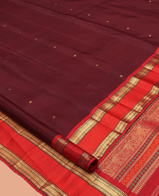 Maroon Kanchipuram Silk Saree, Elevated with Zari Buttas, Complemented by Contrast Border of Rekku, Muthu, Poun, Vanki, and Mayil Kann, Zari Design Pallu, and Contrast Blouse