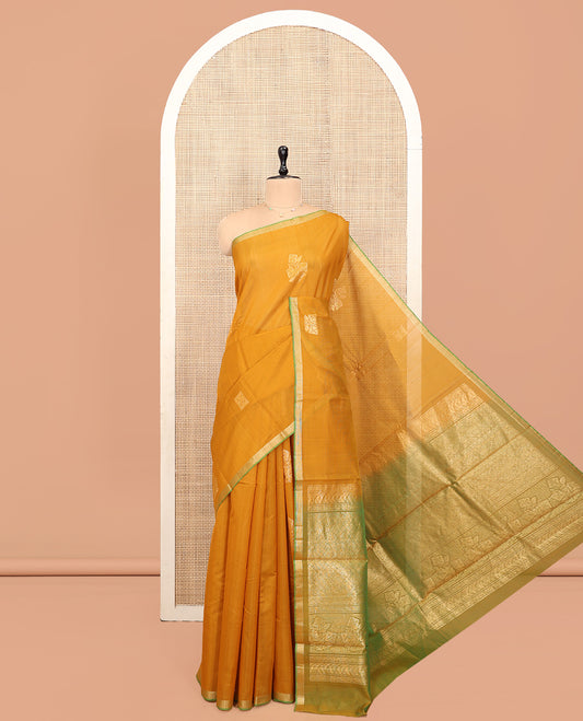Yellow Silk Cotton Saree, Embellished with Zari Buttas, a Subtle Contrast Piping Zari Border, Grand Pallu, and a Contrast Blouse