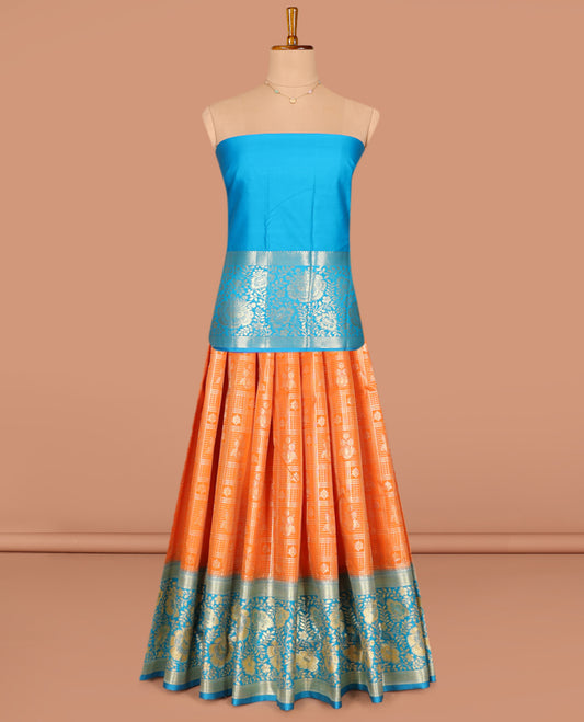 Orange Art Silk Pavadai Material Set, Dazzled with Jacquard Designs on Its Skirt, Complemented by a Contrast Floral Zari Design, Delicately Woven Border, and Paired with a Contrast Blouse