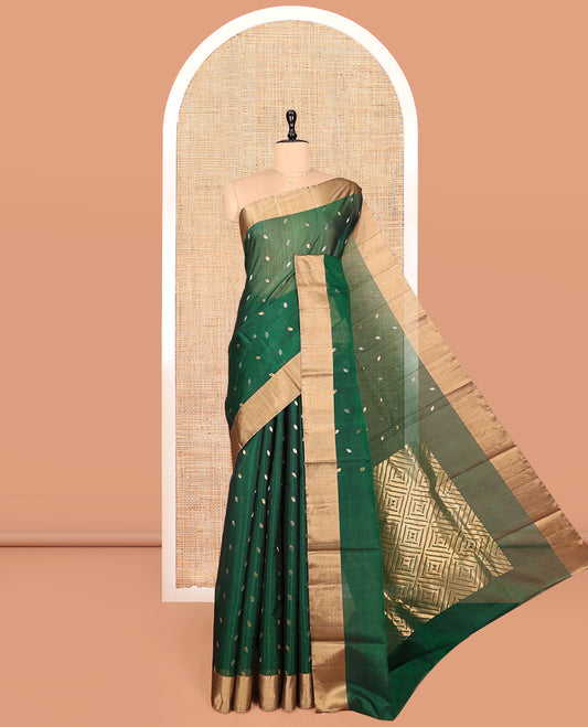 Green Silk Cotton Saree, Embellished with Zari Buttas, a Gleaming Bavanji Border, Pallu of Jaal Designs, and a Matching Blouse