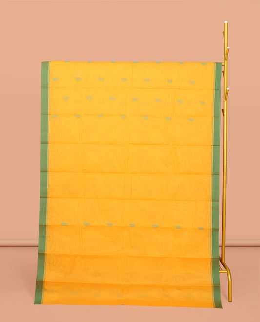 Yellow Kanchi Cotton Saree, Decked Up with Buttas All Over Its Body, Complemented by a Contrast Border, Pallu of Intricate Design, and Paired with a Matching Blouse