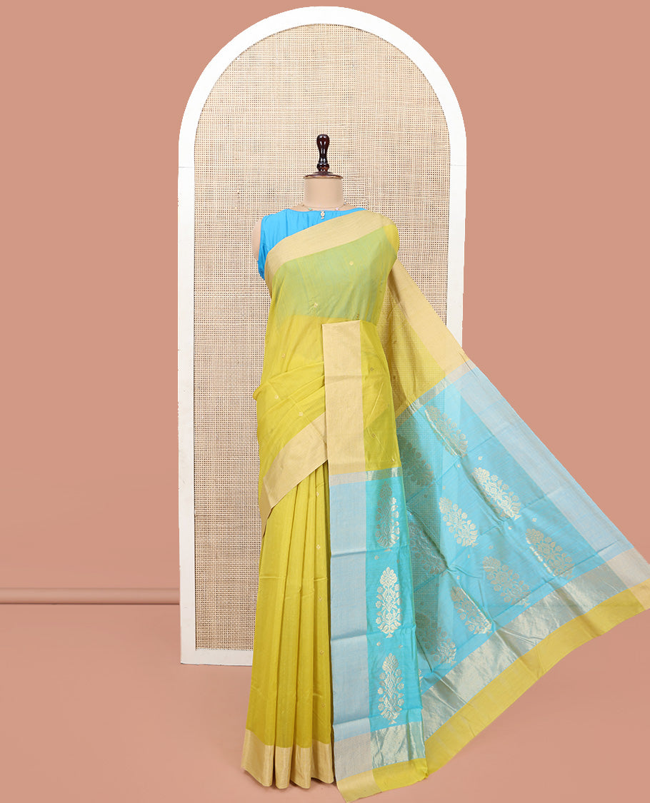 Yellow Chanderi Cotton Saree, Subtly Sparkled with Buttas All Over Its Body, Subtly Woven Bavanji Border, Complemented by a Contrast Pallu of Floral Designs, and Paired with a Contrast Blouse