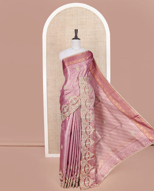 Pink Vastrakala Silk Saree, Opulently Embellished with Floral Jacquard and Patch Stone Work, Highlighted by Traditional Zari Design and Intricate Embroidered Scallop Border, Grand Scallop Design Stone Work Pallu, and Paired with Heavy Embroidered Blouse